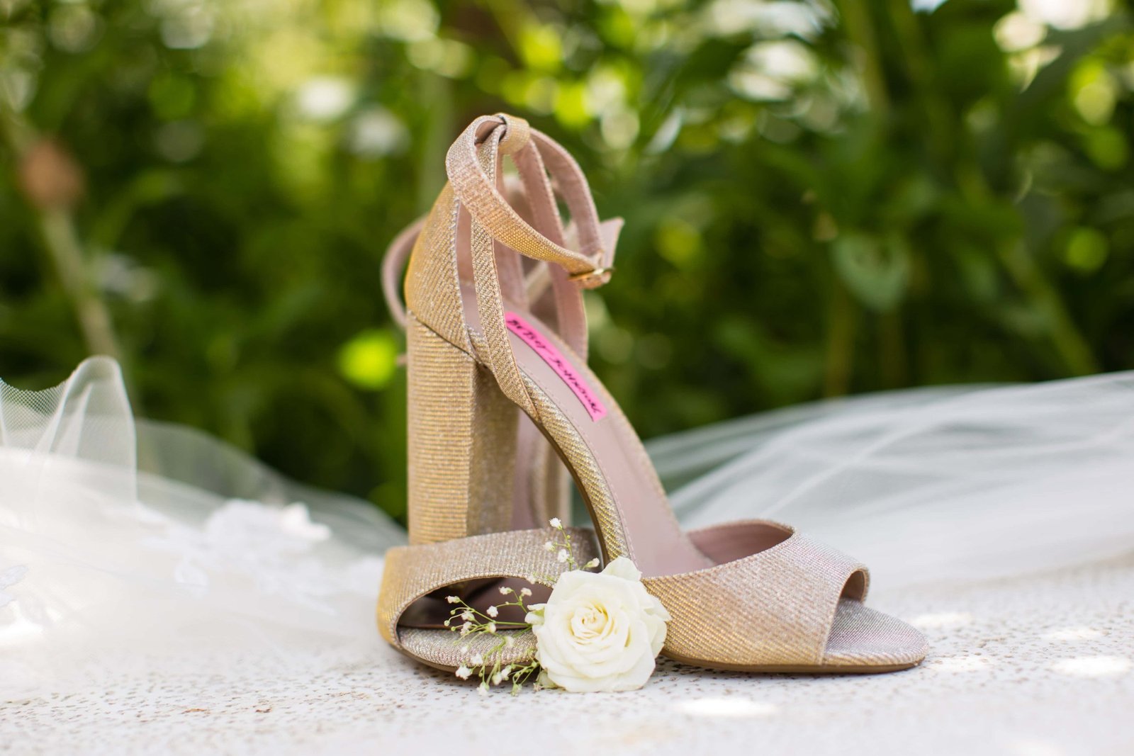Bride's shoes on a stone bench at Heritage House in Arroyo Grande