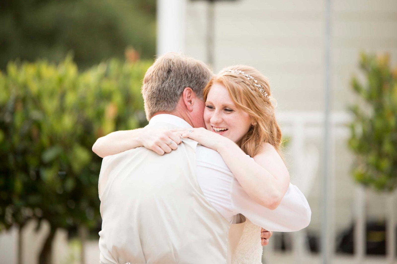 Bride hugging her dad during the father daughter dance at Heritage House in Arroyo Grande