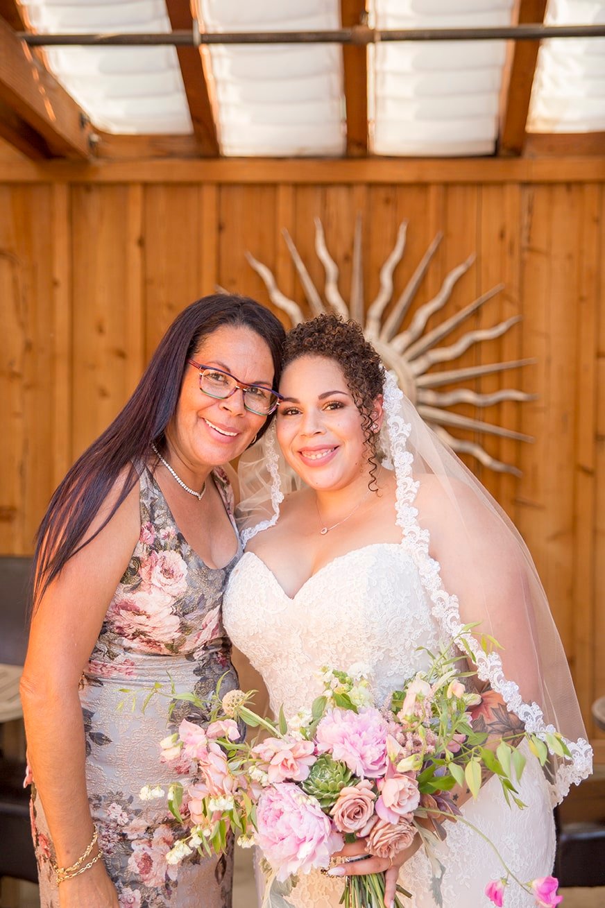 Bride poses with her mom at Roblar Winery in Santa Ynez, CA 