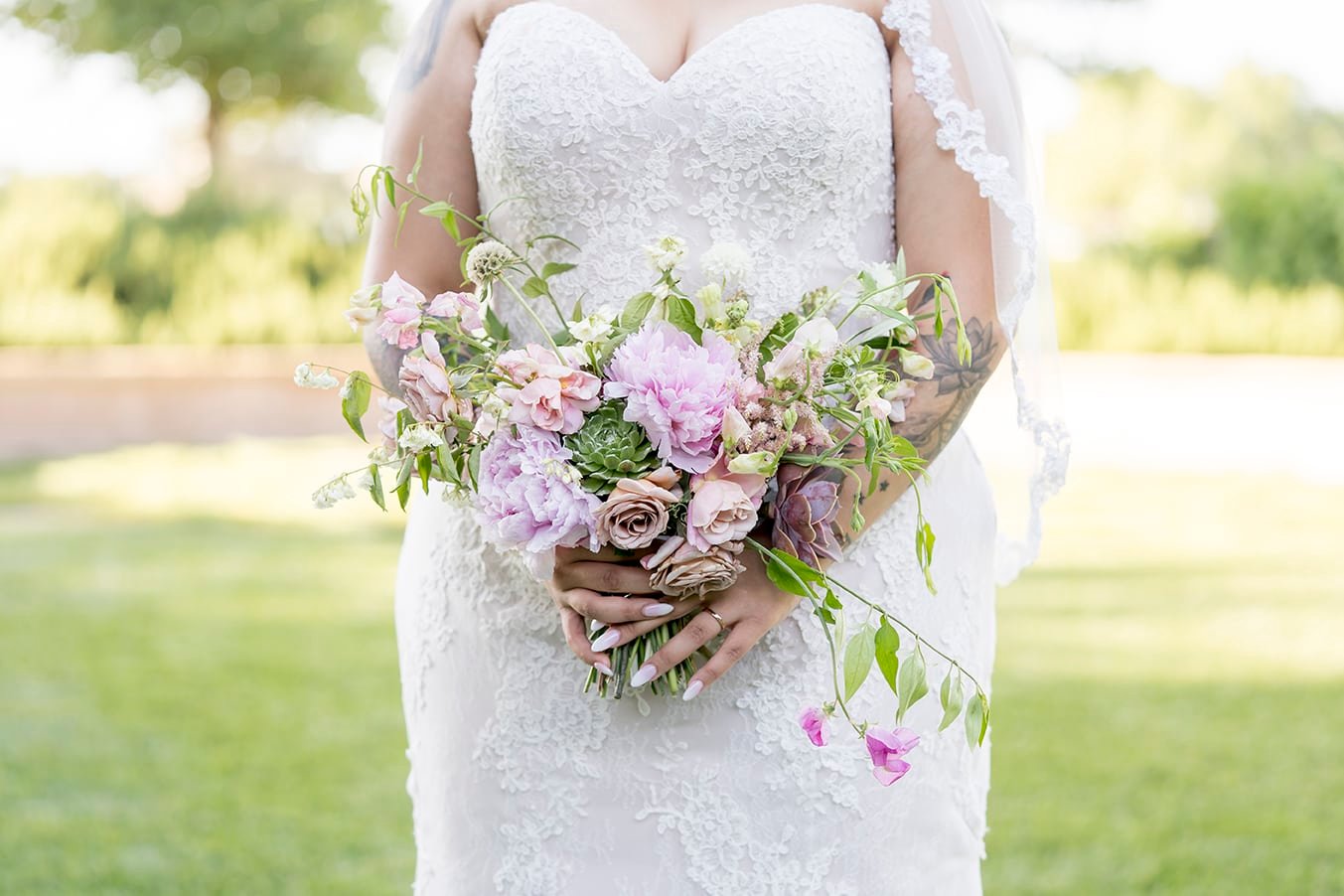 Bride holding a bouquet at Roblar Winery in Santa Ynez, CA