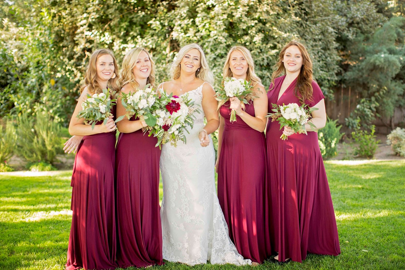 Bride laughing with bridesmaids at The Loading Chute