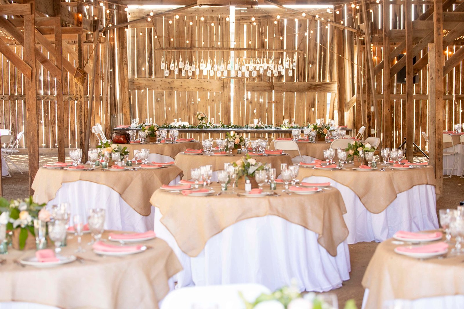 reception tables set up inside the barn at Loma Grande Ranch