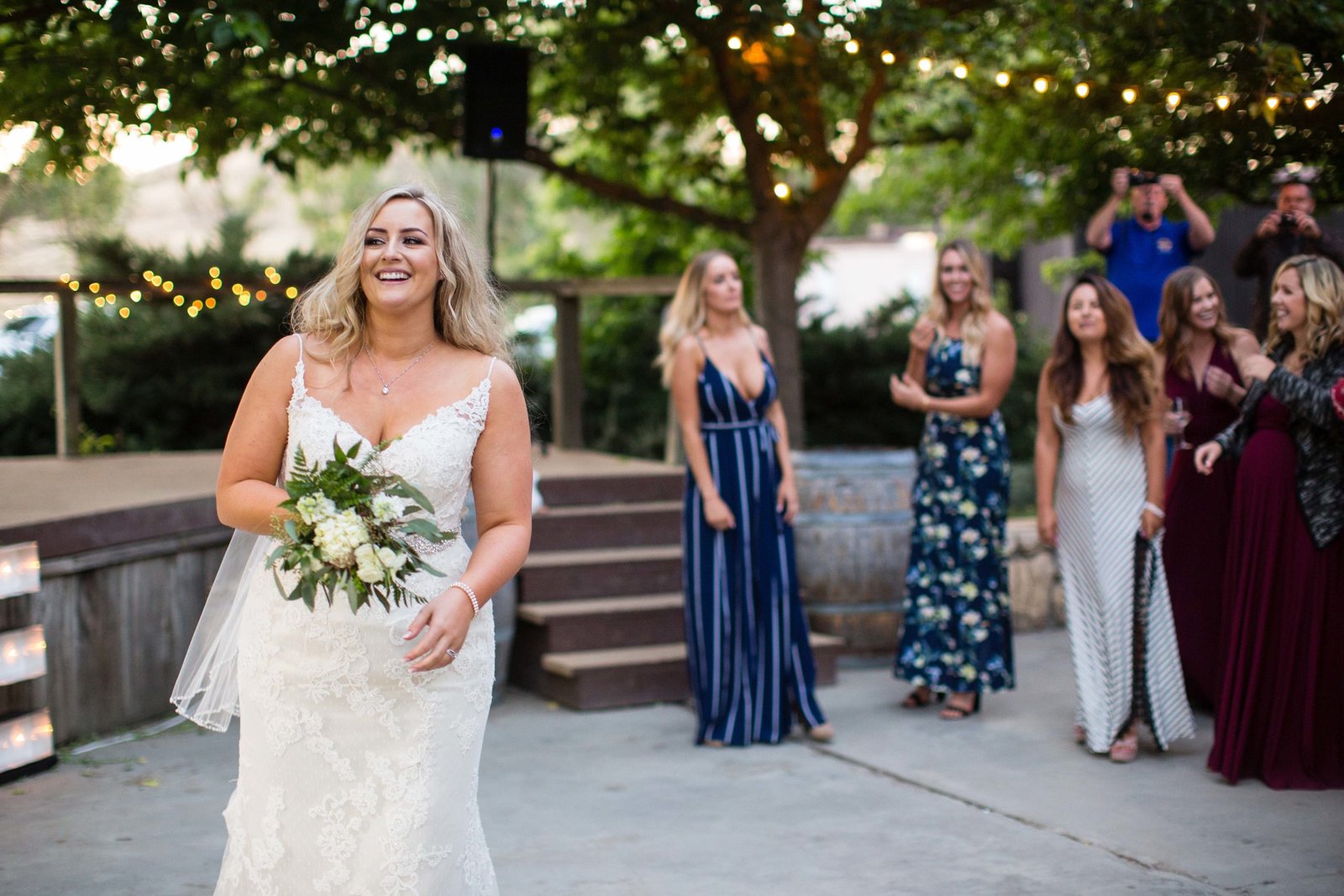 Bride tossing the bouquet at The Loading Chute