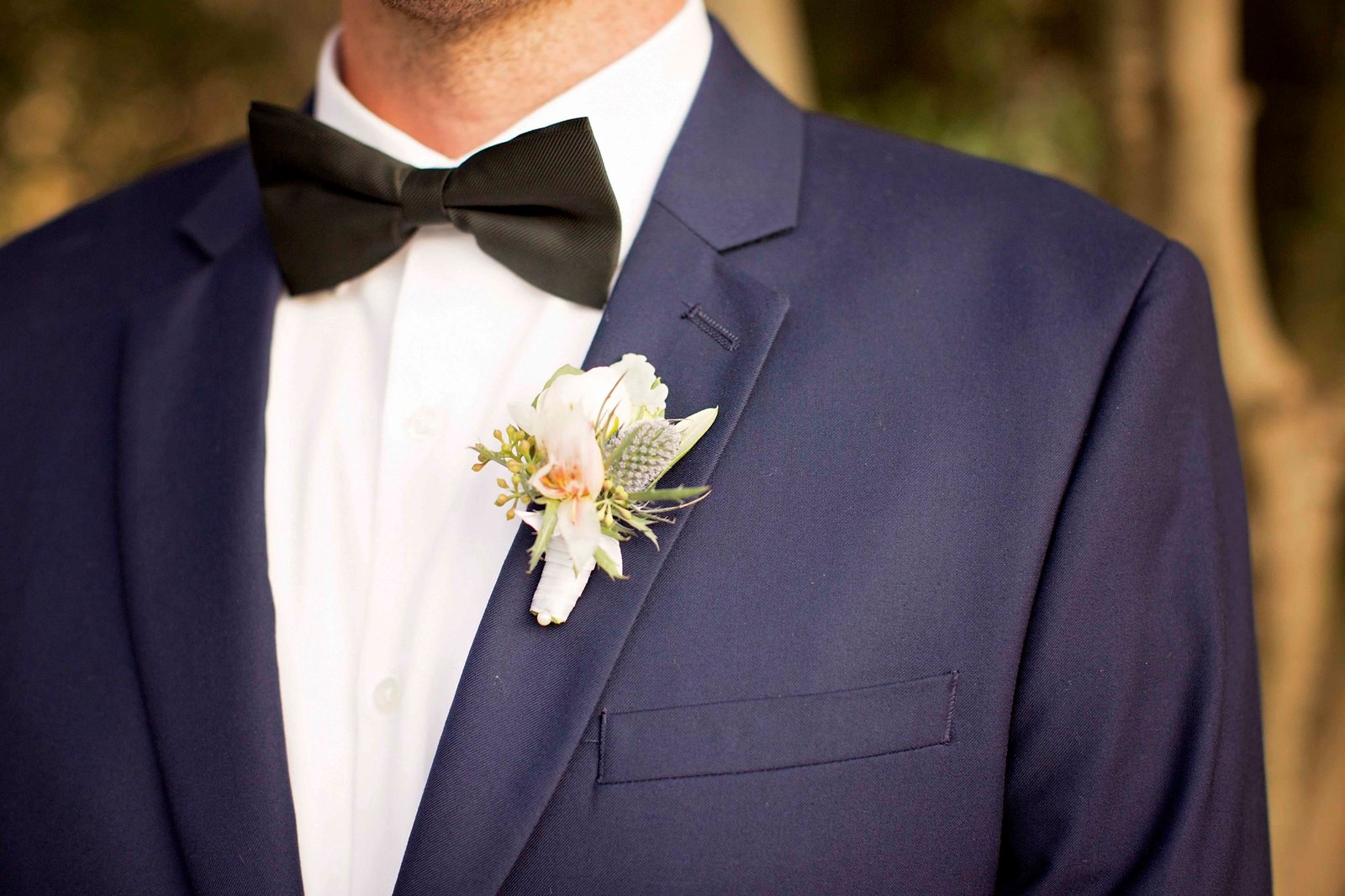 Close up of groom's boutonniere at Higuera Ranch