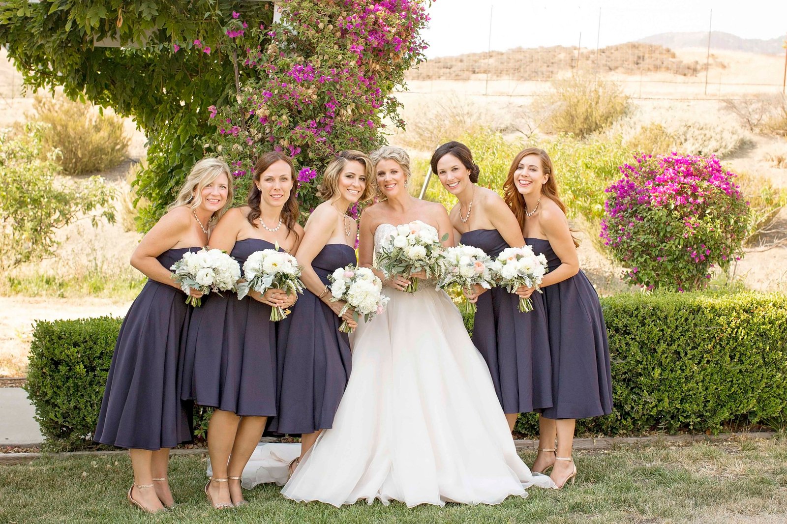 Bride with bridesmaids at Higuera Ranch