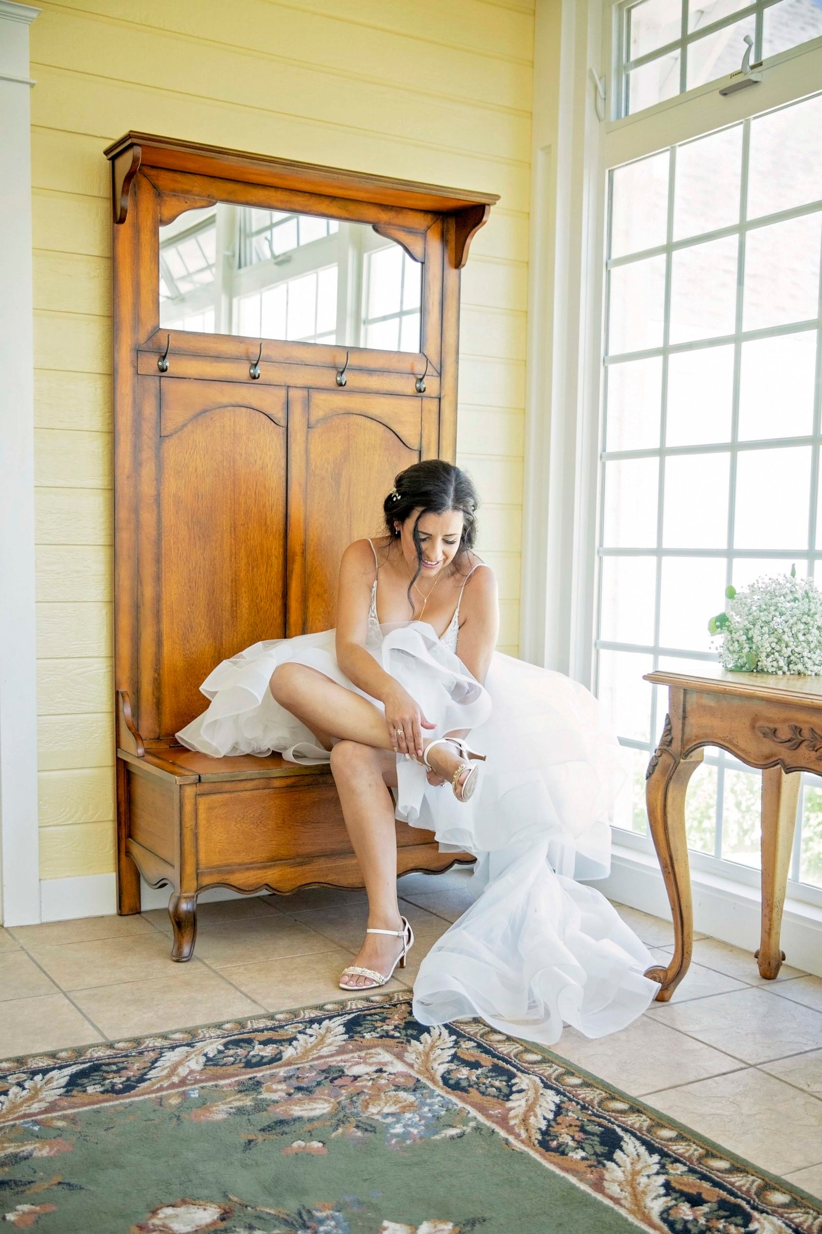 bride putting on her shoes at The Groves on 41