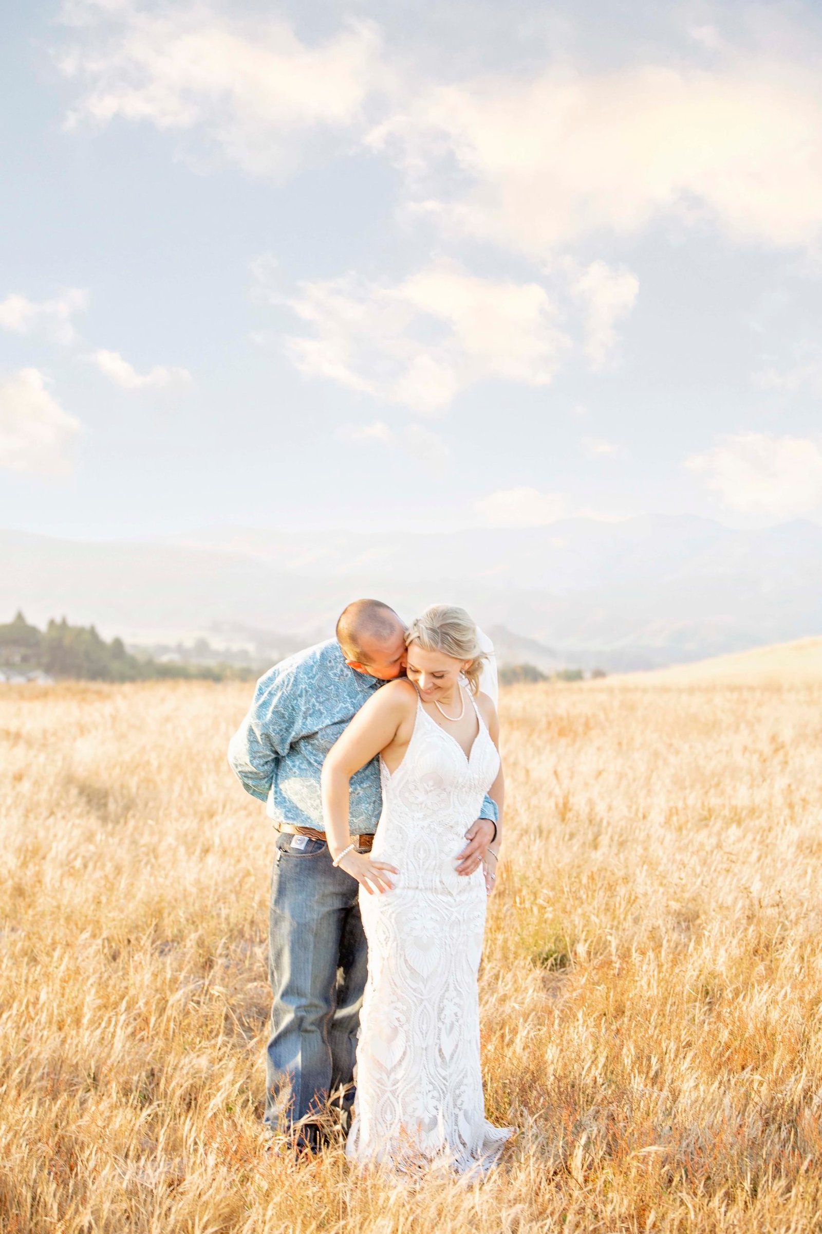 bride and groom posing for a portrait in a field at Loma Grande Ranch