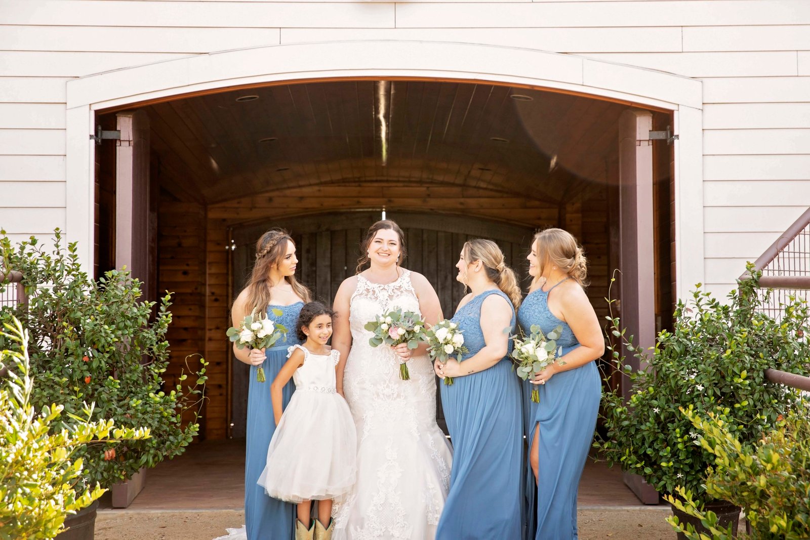 Bride with bridesmaids at Fallen Oaks Estate