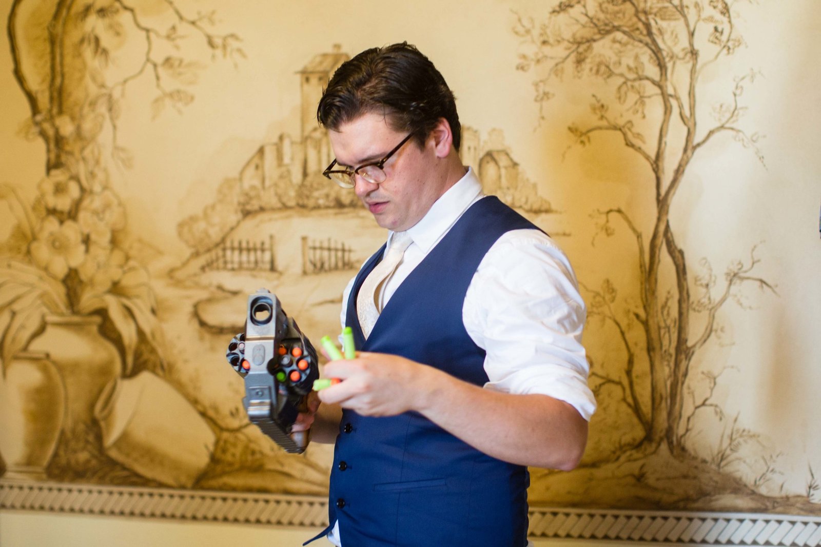 groom holds a nerf gun at The Monday Club