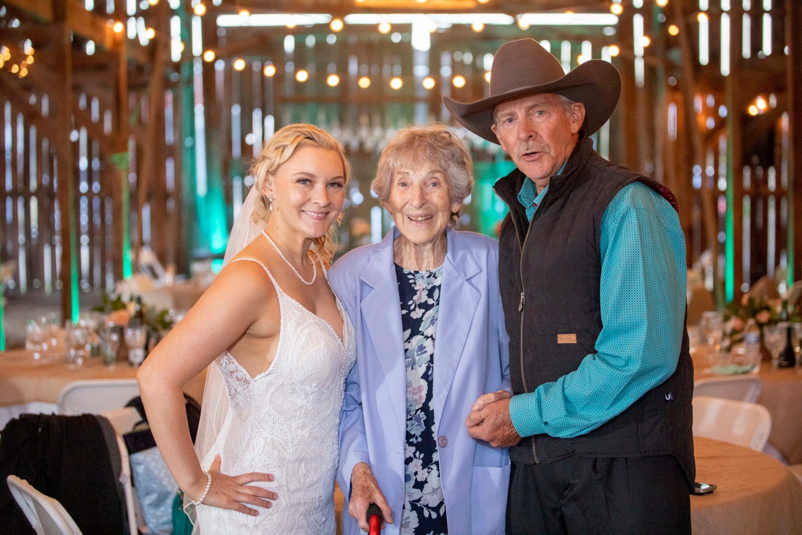 bride with her father and grandma during the wedding reception