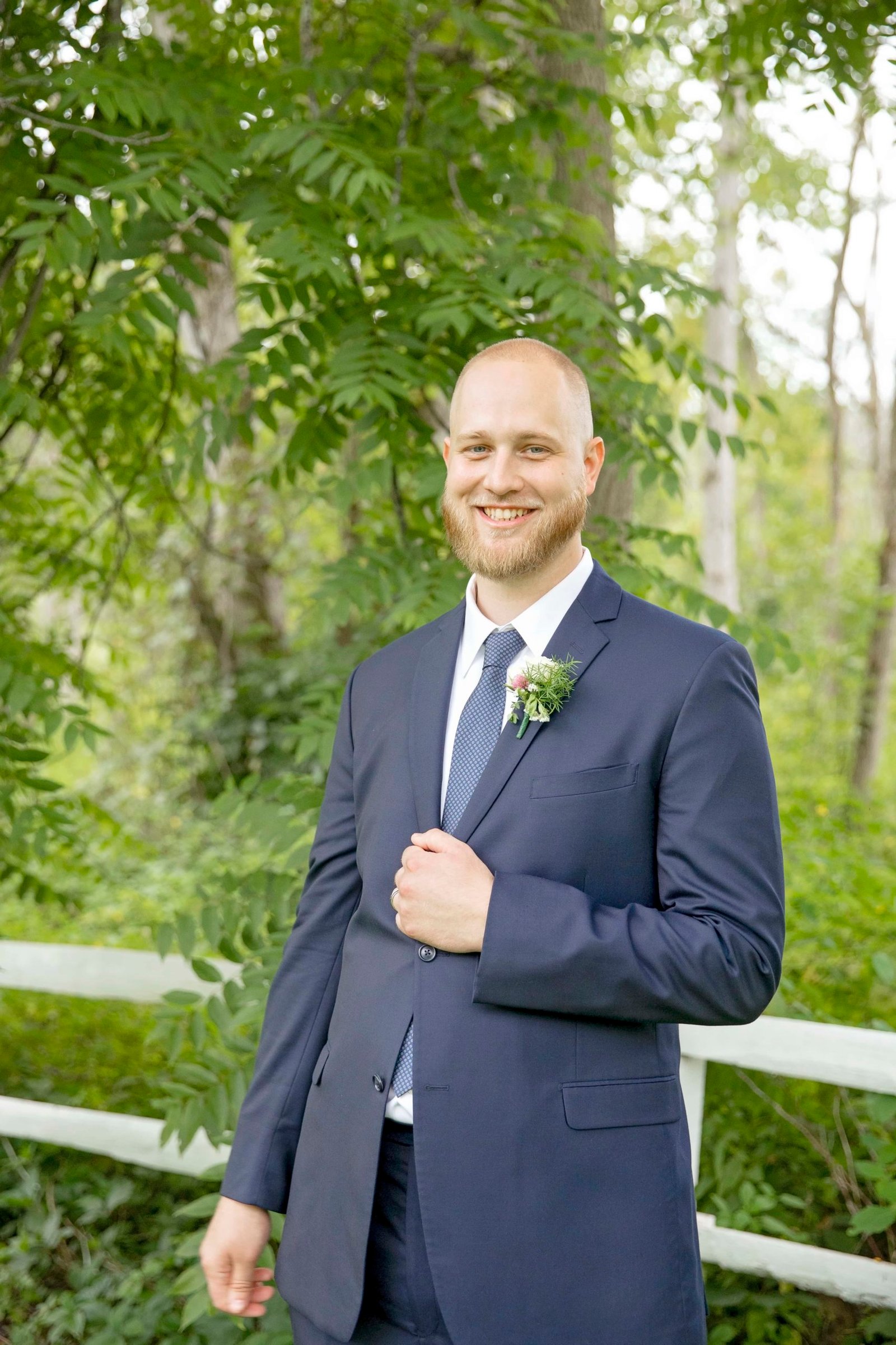 groom smiling at the camera