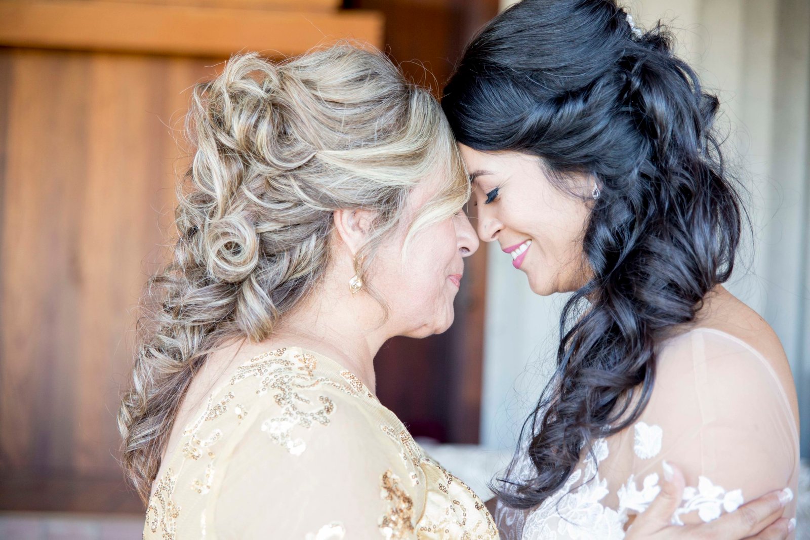 Bride with her mom touching foreheads before the ceremony at Opolo