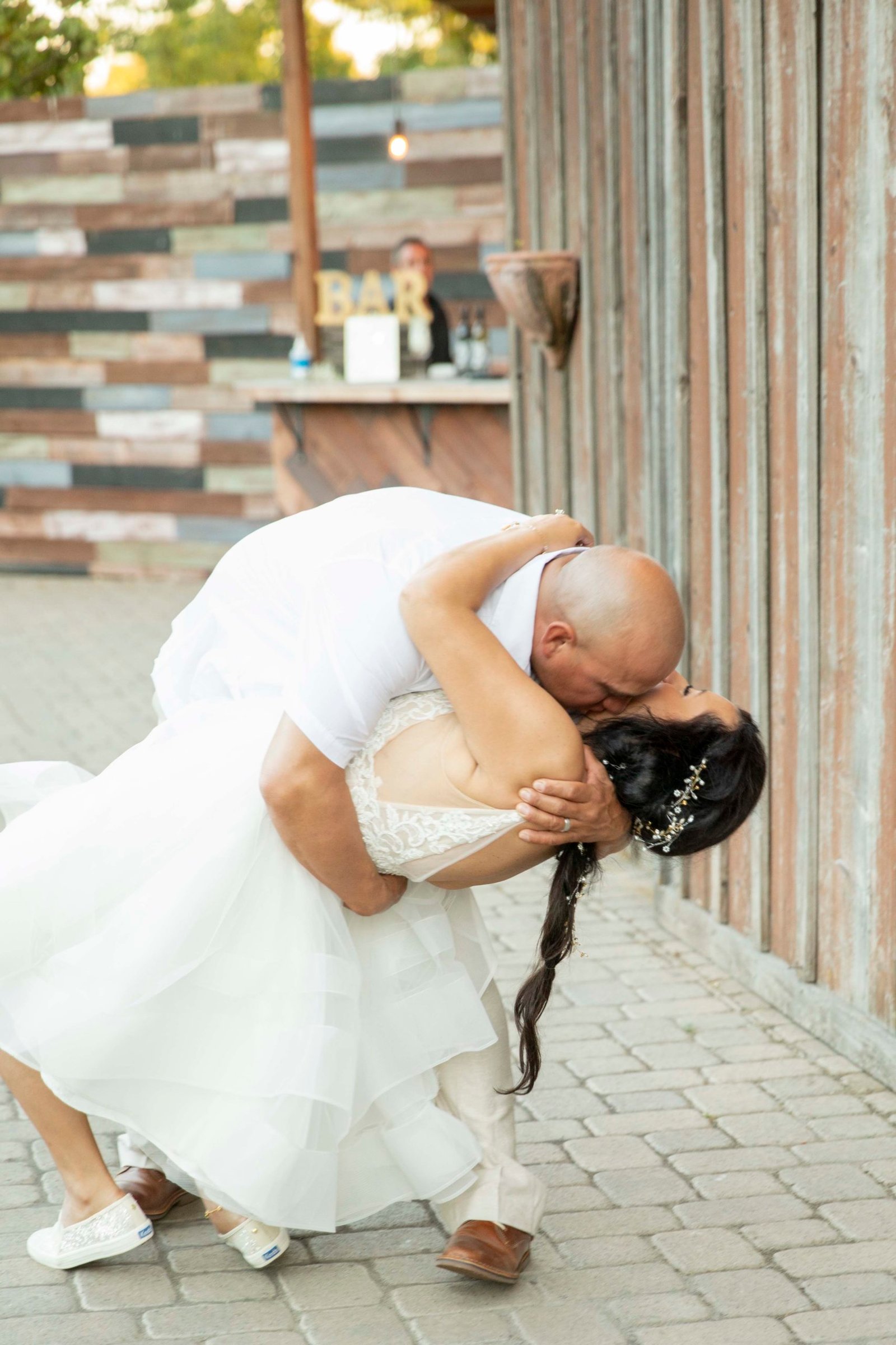 groom dipping the bride for a kiss