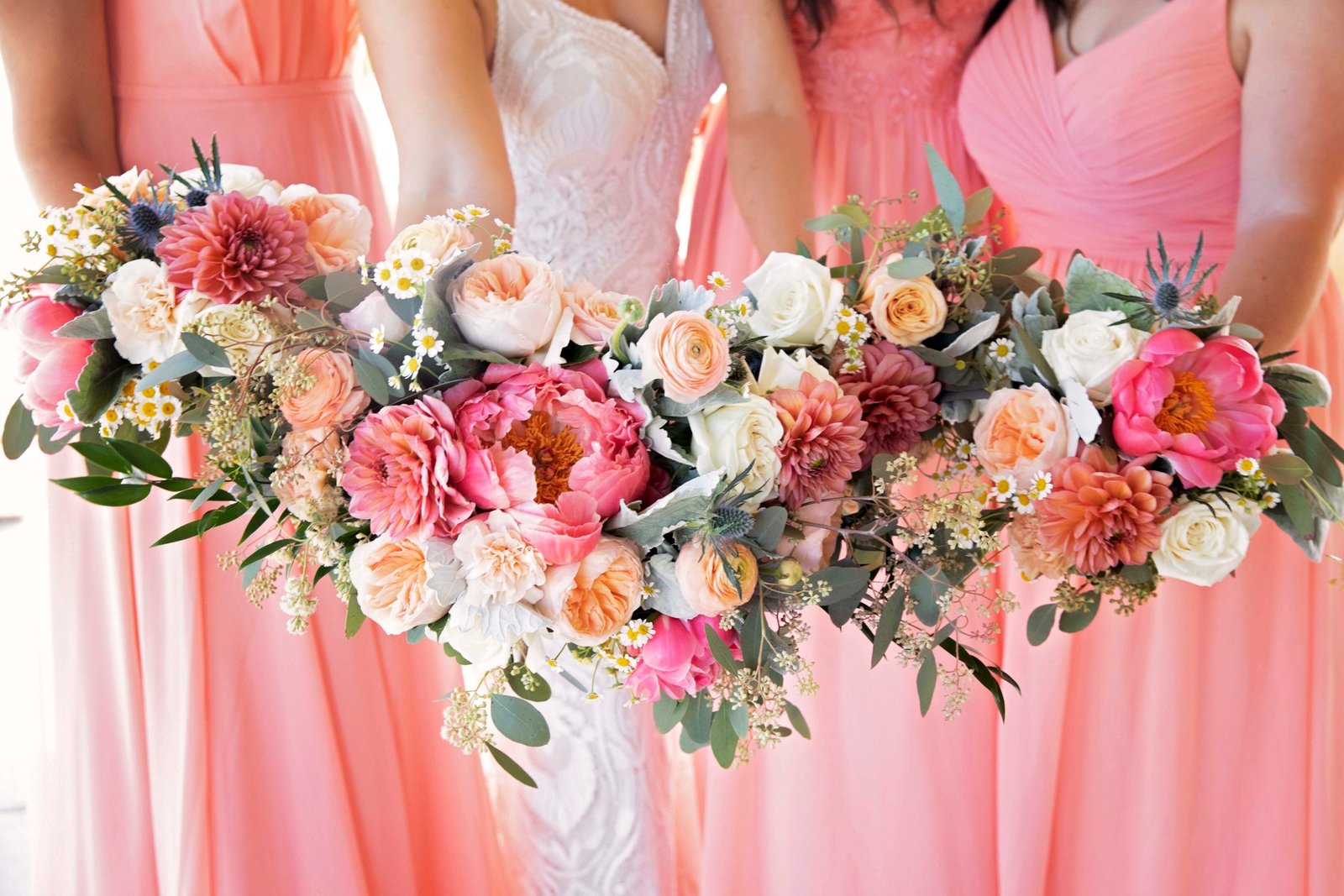 Bridesmaid bouquets in pinks and white