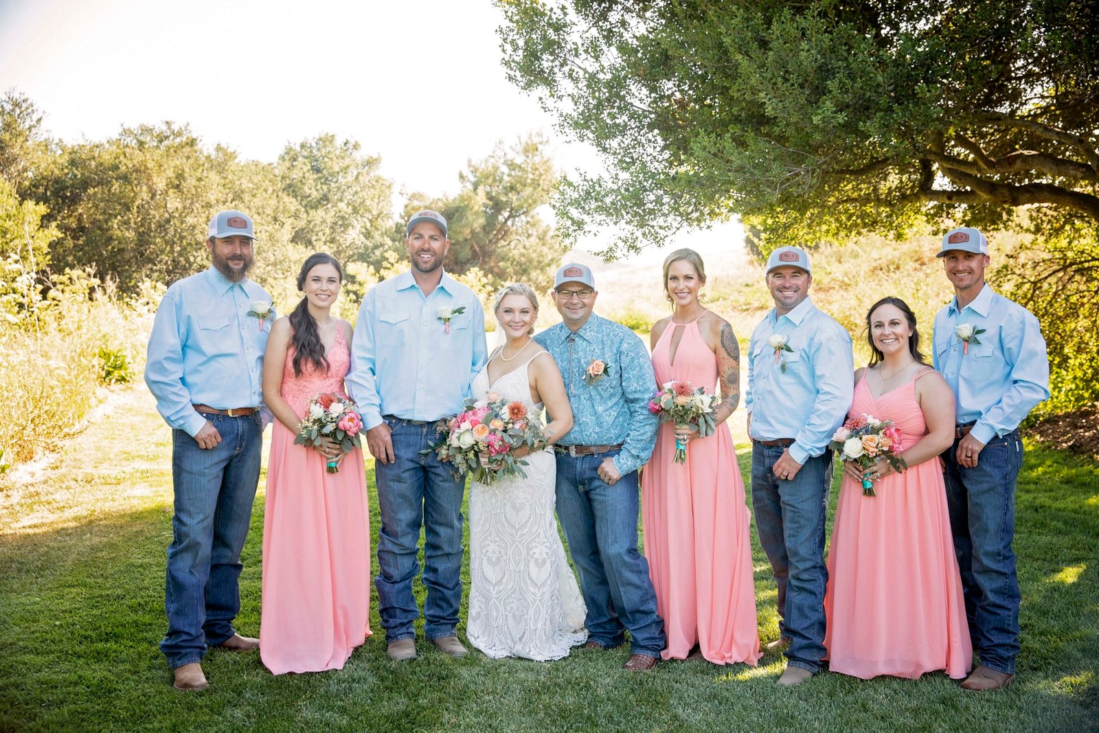 Bride and groom pose with the wedding party at Loma Grande Ranch