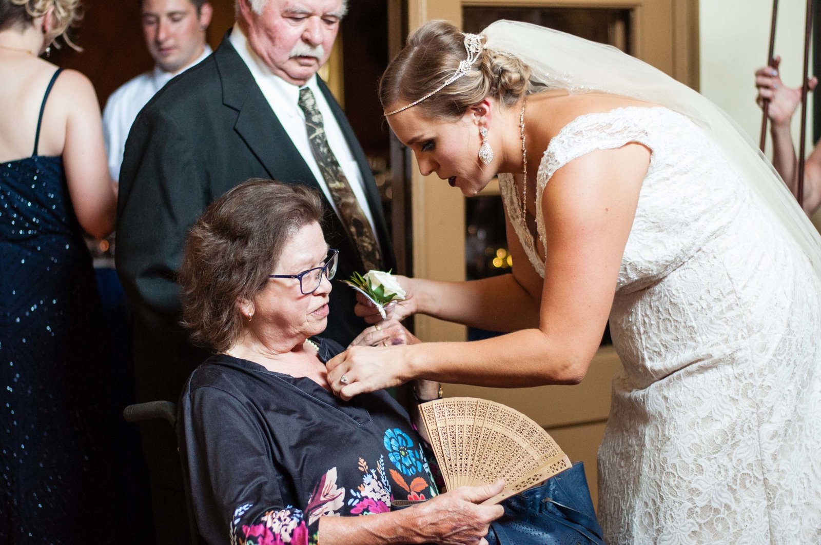 Bride pinning a corsage on her grandma at The Monday Club