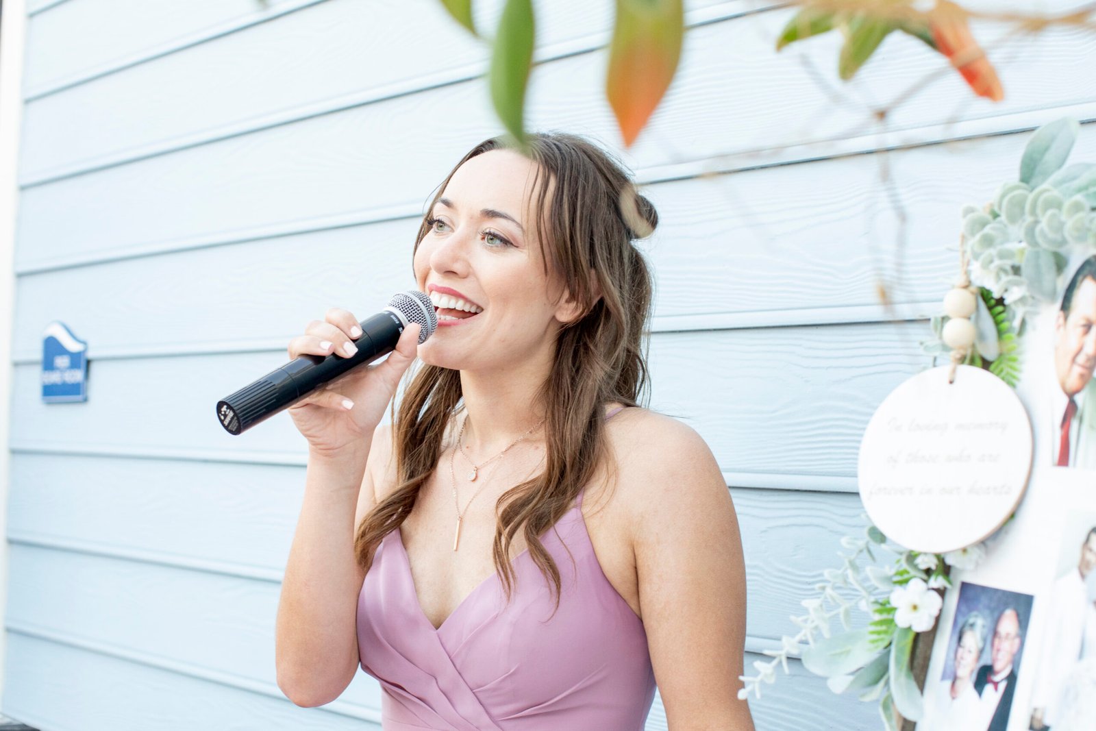 bridesmaid singing into a microphone