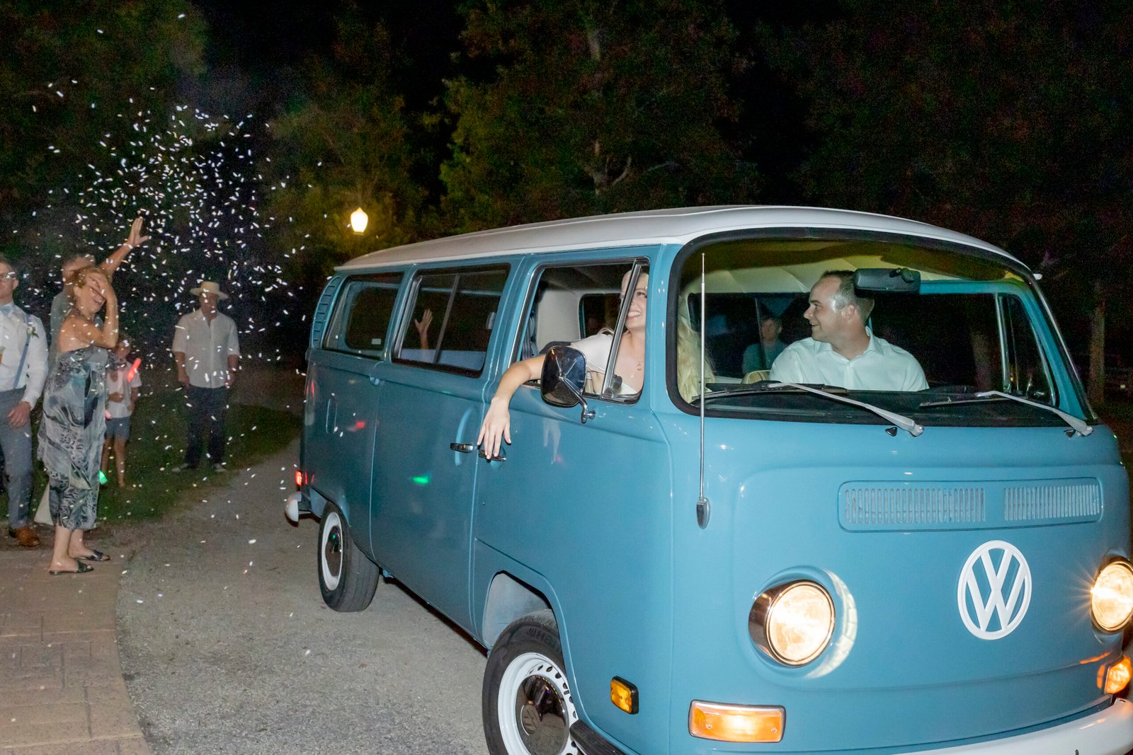 Bride and groom grand exit in a VW bus while the guests tossed lavender