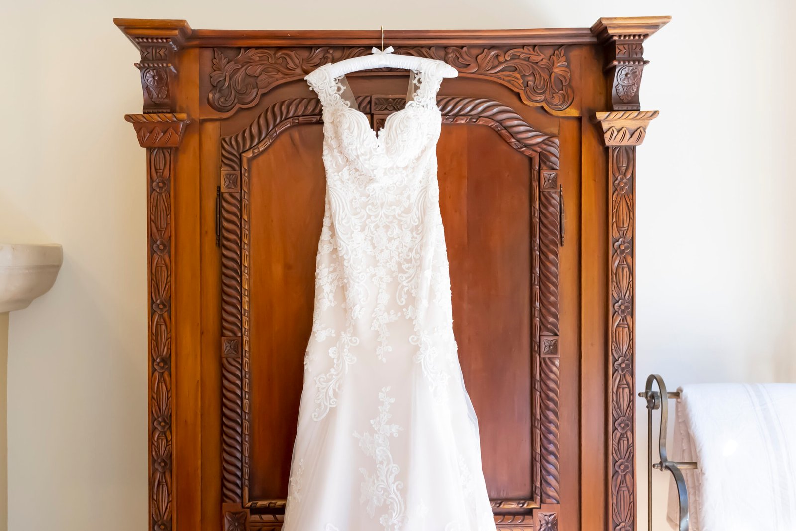 wedding dress hanging from a wardrobe in the Winemaker's suite at CaliPaso