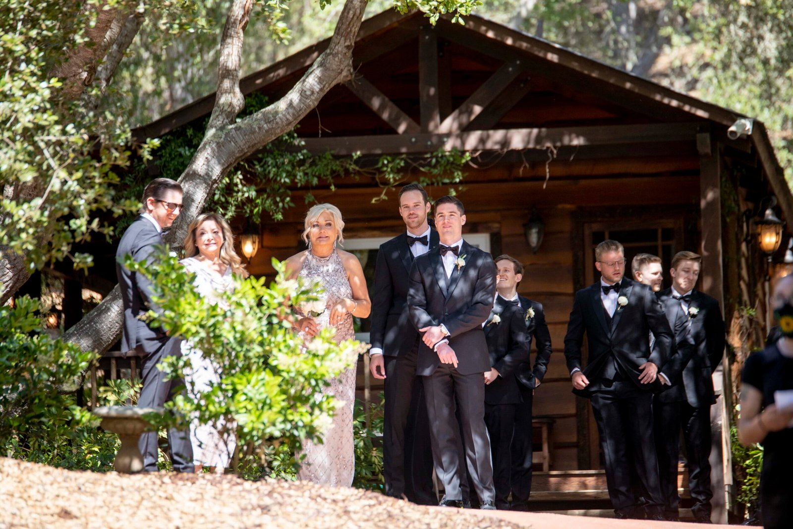 groom with family and groomsmen waiting to walk down the aisle