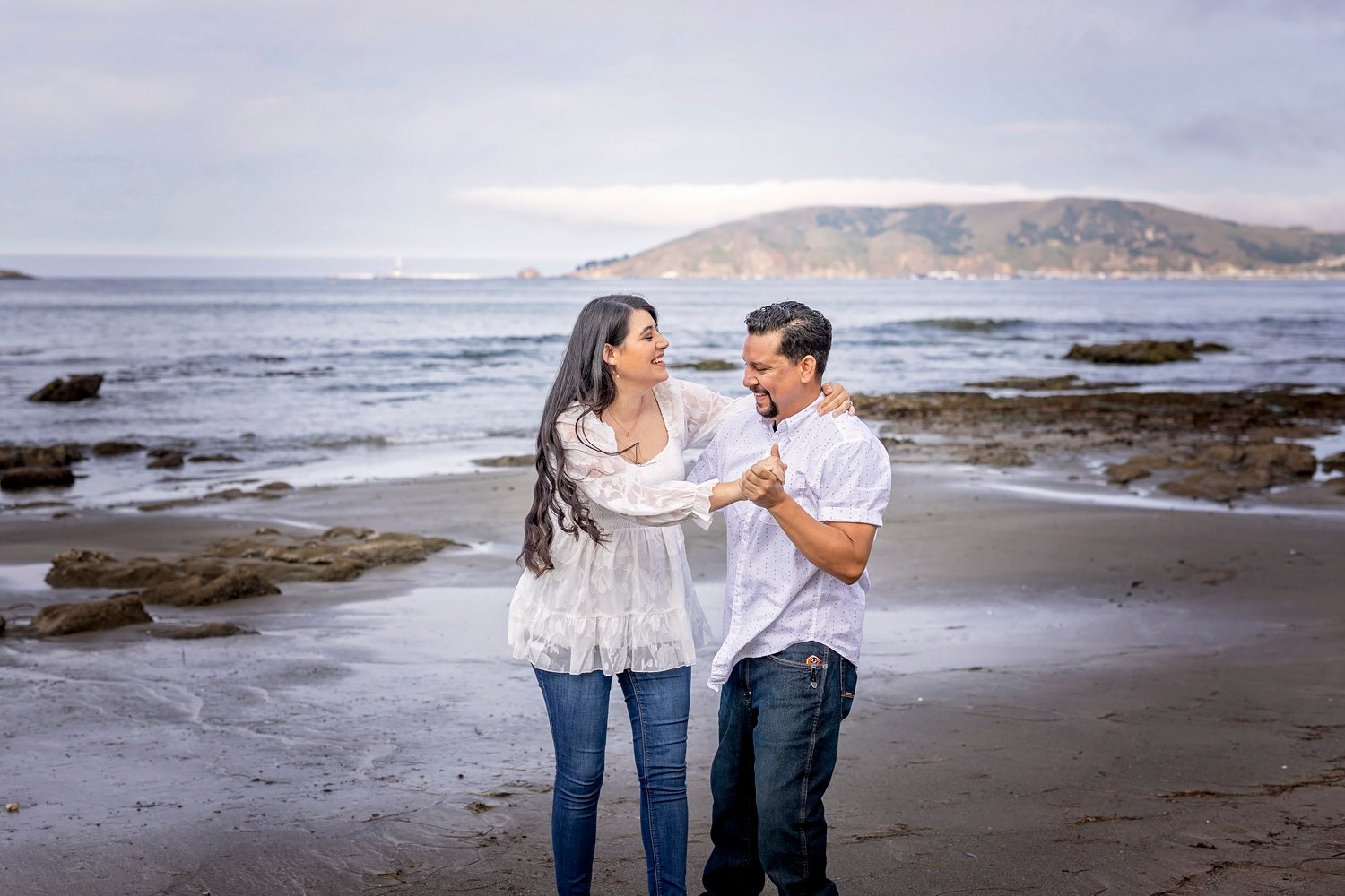 Couple dancing on the beach in Pismo