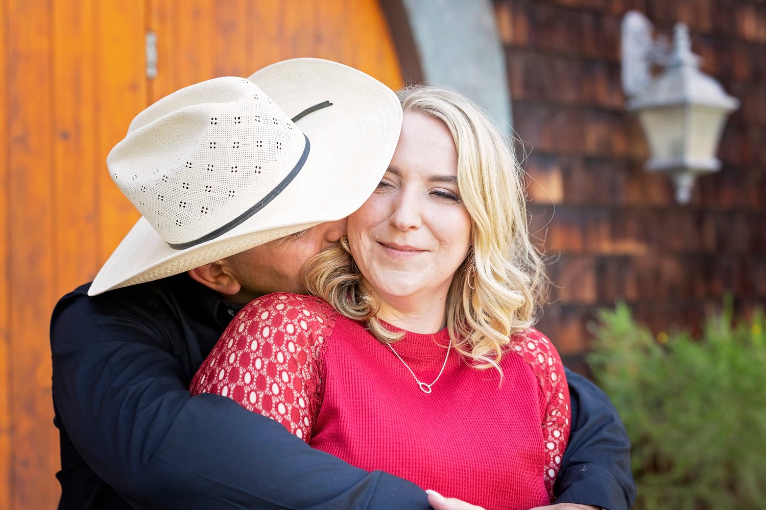 couple nuzzles into each other during an engagement photo session