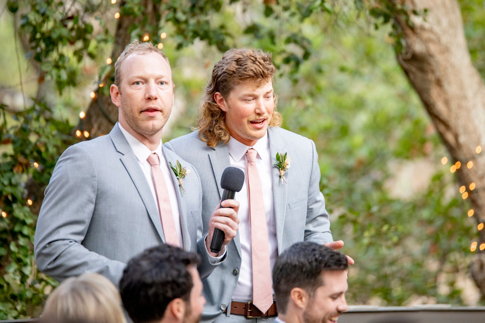brothers giving a speech at a wedding