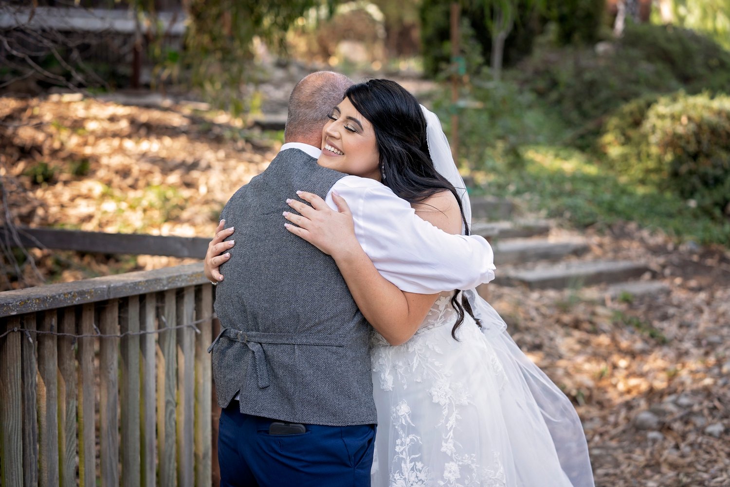 bride embraces her dad during the first look