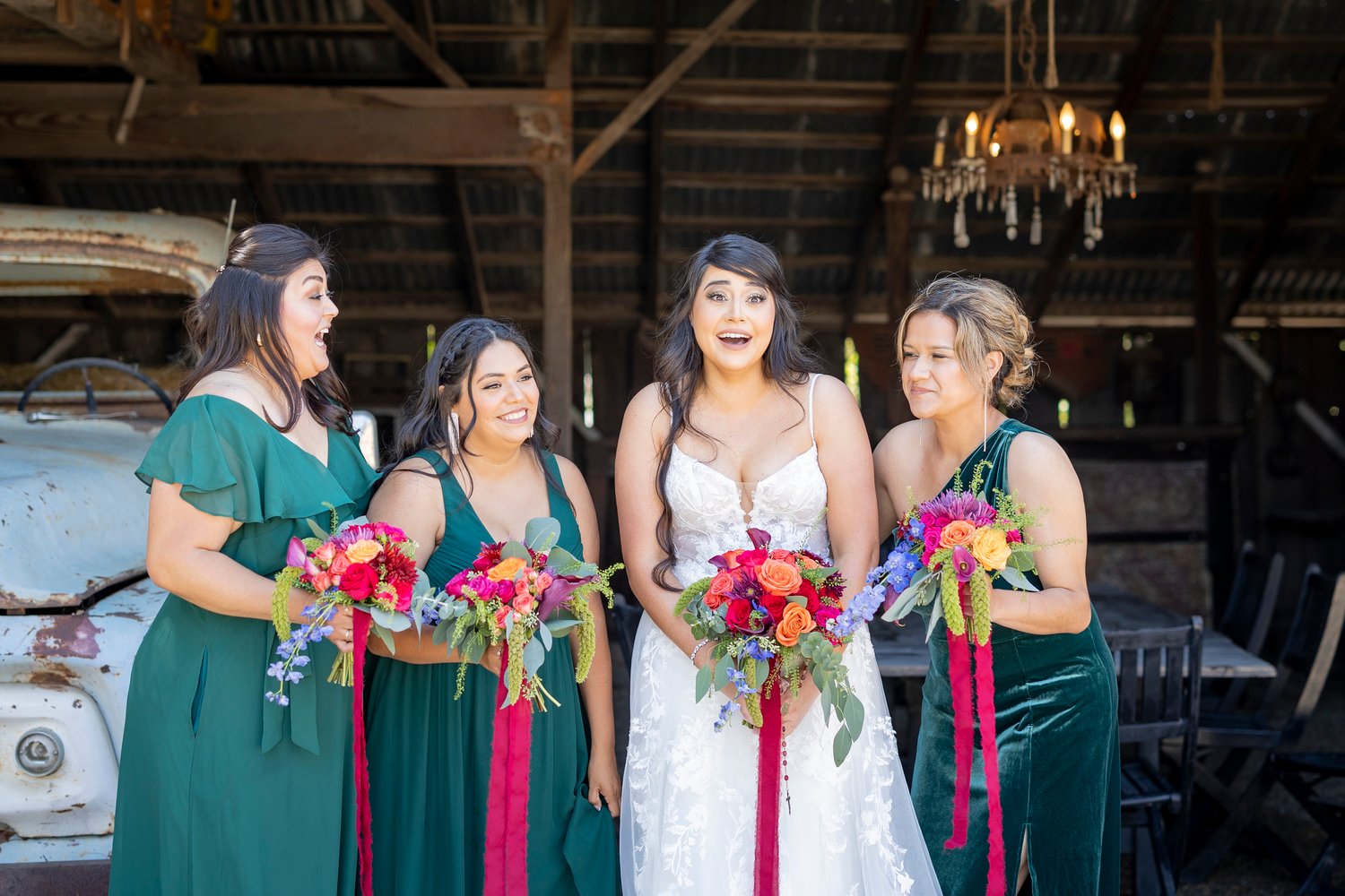 bride smiling with her bridesmaids