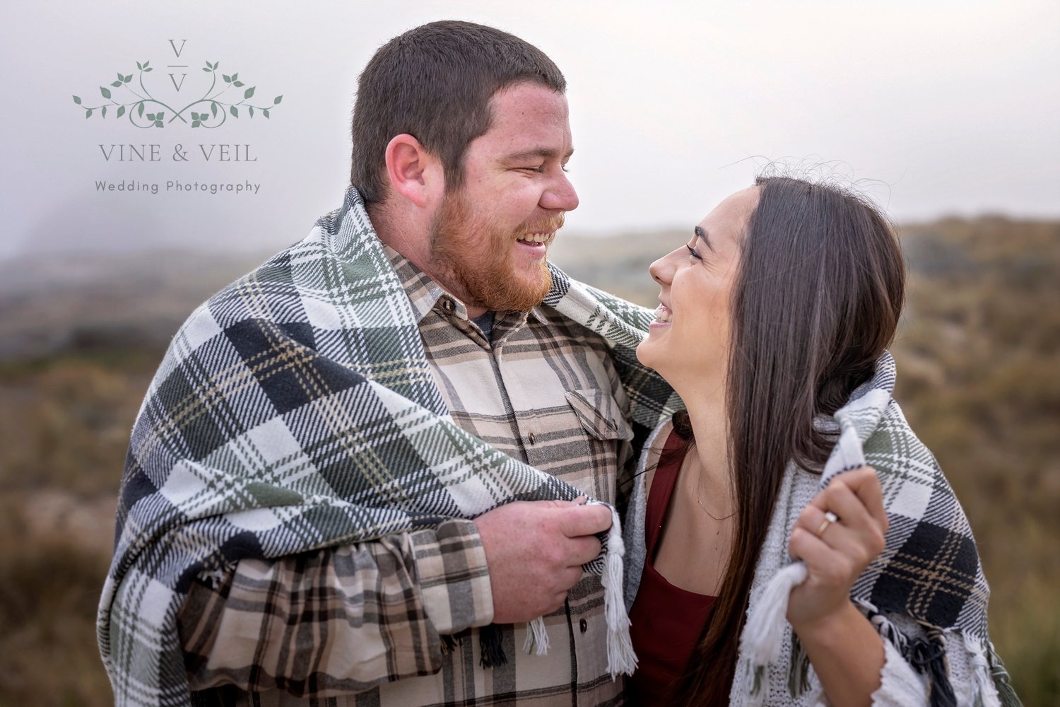 couple looking at each other during their engagement photos