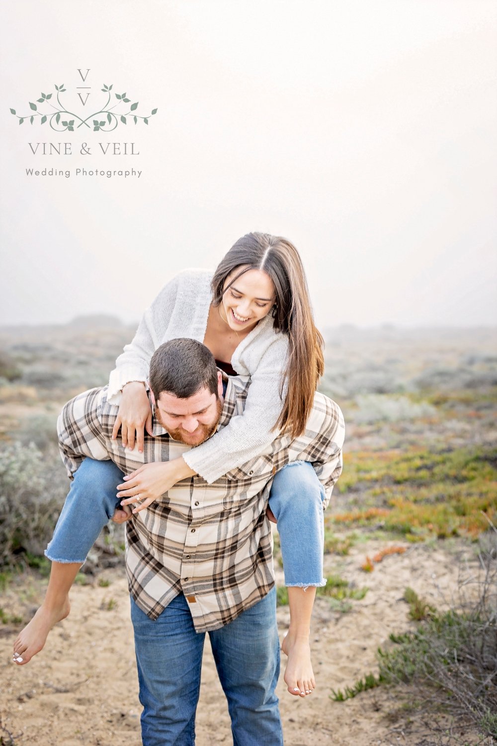 couple playing with a piggy back ride during an engagement photo session