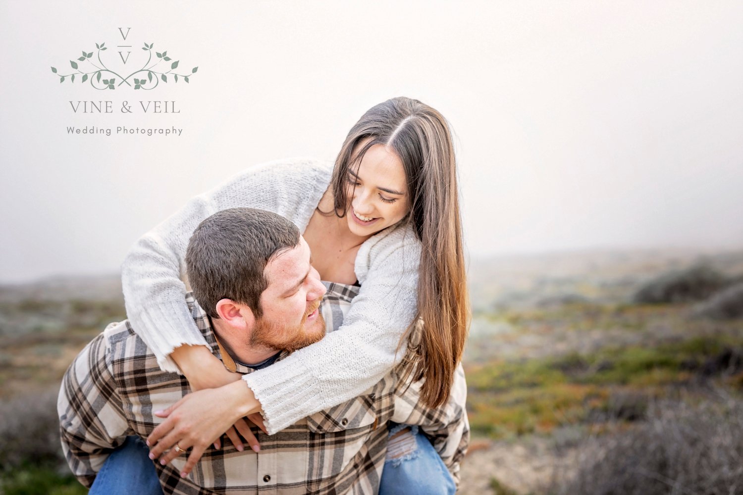 couple playing during their engagement photoshoot